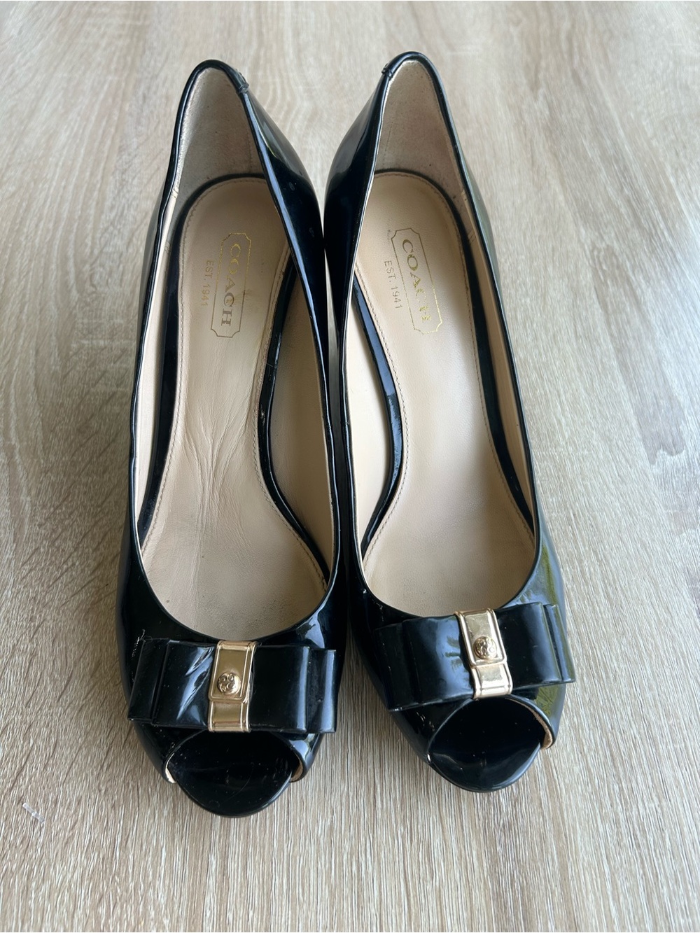 Coach Women's Black Patent Leather Peep-Toe Wedge with Gold Accent